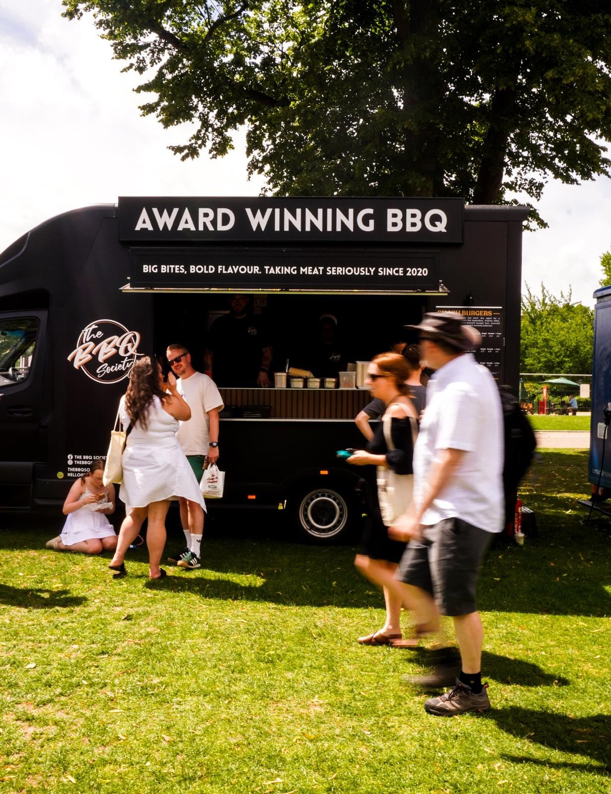 The BBQ Society catering van serving at an outdoor event